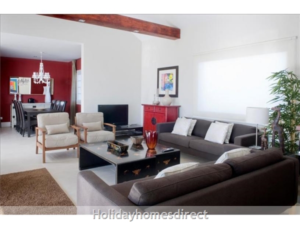 Villa Franca indoor sitting room with a table