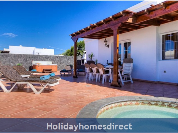 Villa Ariana outdoor dining table and sunbeds